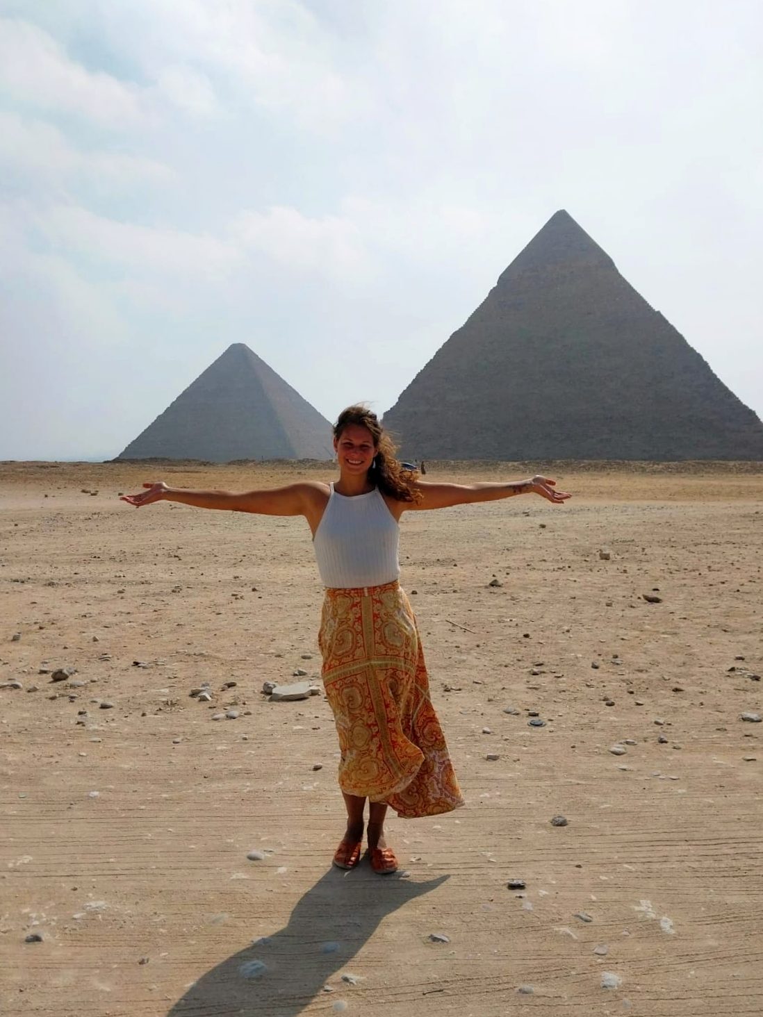 Nikita at the pyramids of Giza, Egypt, arms wide open